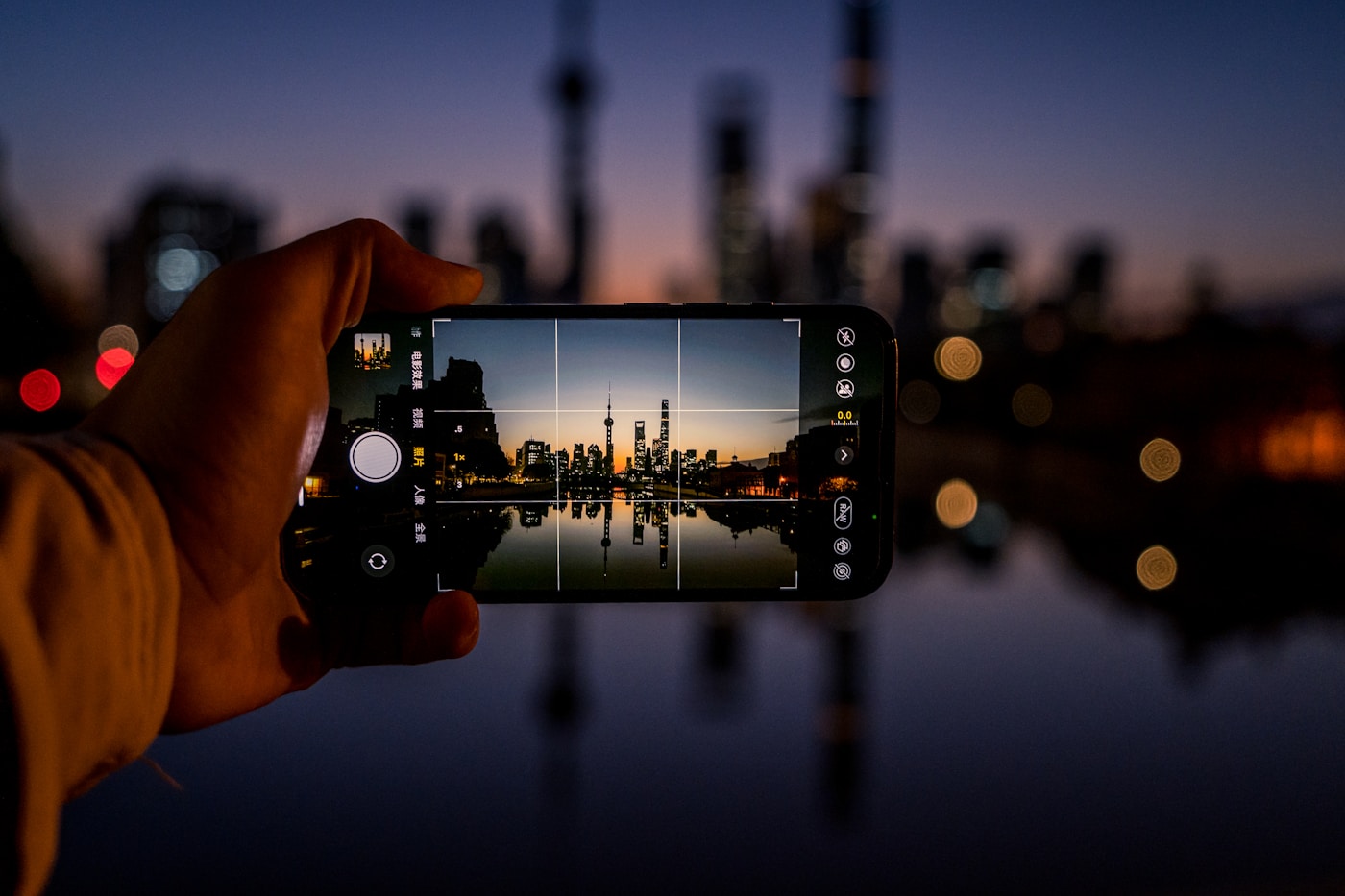 Traveler using a smartphone in Shanghai before a China trip